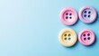 © Murda - Four colorful buttons on blue background.