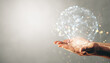 © Who is Danny - Hands holding a virtual hologram sphere with connected data points on a light background.