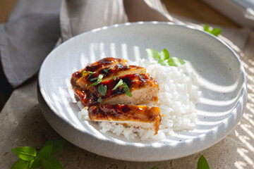 Chicken fillet in sweet and sour sauce with rice