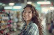 © Vorda Berge - Portrait of a young Hispanic female retail sales associate