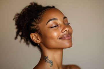 A close up of a tattooed black woman's face with her eyes closed