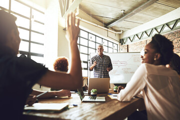 Wall Mural - Business people, presentation and employee in office with question, participation and engagement in meeting. Marketing agency, team and mentor with whiteboard for training, skills development or goal