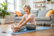© KingKongThePitbull - Asian Elderly woman sit mat doing Stretching At Home