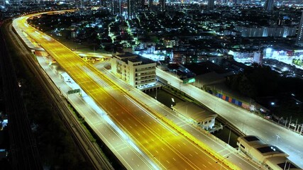 Poster - Traffic an important infrastructure, financial technology, Expressway top view, traffic transportation above intersection road in city night sky aerial view cityscape of advanced innovation,Hyperlapse