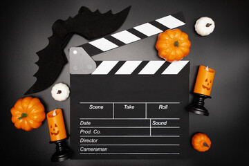 Wall Mural - October celebration, horror Halloween movie set, cinematic clapper board and spooky decorations.