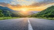 © Eduard Muzhevskyi - Empty highway stretches into distance, surrounded by lush green mountains. Vibrant sunset paints sky in golden hues. Perfect blend of nature and infrastructure, ideal for road trip enthusiasts.