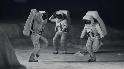 Canvas Print - Three astronauts dance happily on the moon