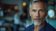 © Светлана Гуркова - Portrait of a mature man with silver hair and blue eyes in a cafe setting during the daytime