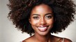 © Nima - A beautiful black woman with curly hair smiles brightly at the camera, showcasing her natural beauty and confidence. The image symbolizes positivity, self-love, and embracing diversity.