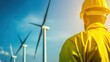 © rookielion - Maintenance crew working on wind turbines at a largescale wind farm representing green energy efforts
