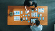 © Summit Art Creations - Top view of software developer working on Ux Ui design while team working together to brainstorm and develop wireframe prototype designing at creative digital company. Teamwork concept. Convocation.