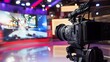 © Felippe Lopes - A professional video camera sits ready to film in a television studio.