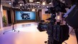 © Felippe Lopes - A close-up of a camera in a television studio, ready for a live broadcast.