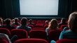 © forenna - audience in a movie theater eagerly awaiting the start of a film, with the anticipation palpable as viewers settle into red seats and focus on the blank screen, ready for the upcom