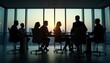 © abu - Silhouettes of executives in a glass meeting room, with dramatic lighting and city glow adding depth and contrast to the sleek design.