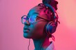 © Deris Firmansyah - Fashion pretty woman with headphones listening to music over red neon background at studio.