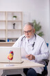 © Elnur - Old male doctor in telemedicine concept