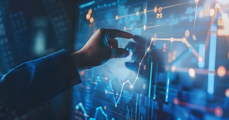 Businessman touching an upward growing line graph on a virtual screen, depicting business growth.