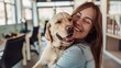 © Creations Photo  - Happy businesswoman embraces her Labrador therapy dog and having fun in office.