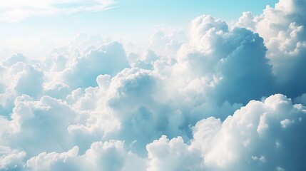 Above the Clouds: A serene aerial view captures a breathtaking expanse of fluffy white clouds against a bright blue sky. The soft, ethereal light creates a sense of peace and tranquility.