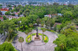 Colonial charm: Aerial view of Morelia's Plaza de Morelos, surrounded by verdant beauty, with the ancient aqueduct as a stunning backdrop