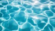 © venusvi - Clear, blue water surface with gentle ripples in a swimming pool, capturing the serene and tranquil effect of sunlight dancing on the water.