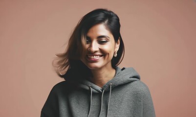 Wall Mural - Portrait of a beautiful asian woman smiling on a pink background