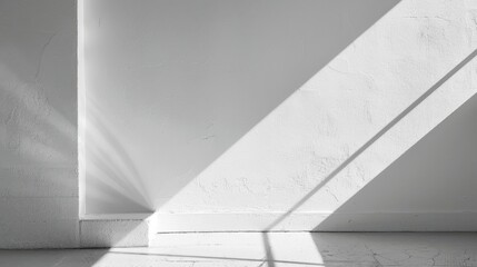 Aufkleber - A single window casts a beam of light onto a white wall and floor in a bright, minimalist room. The shadows from the window frame create a stark contrast against the white surface, giving the image a 