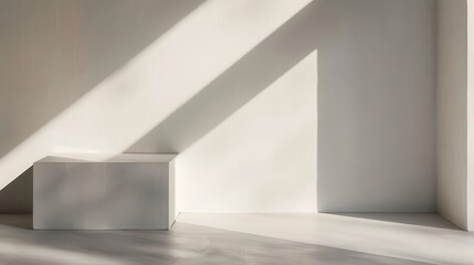 Aufkleber - A single white platform sits in an otherwise empty room, bathed in the soft glow of diagonal sunlight streaming through a window. The room is painted white and has a minimalist design, emphasizing the