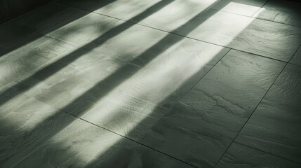 Poster - Sunlight streams through a window, casting long, parallel shadows onto a tiled floor. The light illuminates the textured surface of the tiles, highlighting their natural pattern.