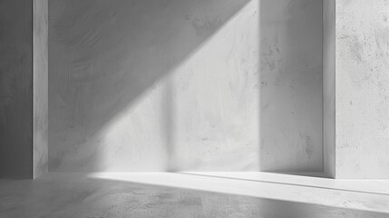 Aufkleber - A bright beam of sunlight shines through a large window and casts a long shadow across the floor of a modern concrete room. The walls are smooth and white, with a minimalist aesthetic.