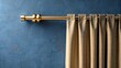 © Collection - Golden curtain rod holding gray curtains against a textured blue wall, home decor, interior design