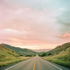 Poster - A long, straight road cuts through rolling hills, with a picturesque sunset sky.