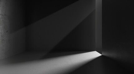 Poster - A narrow beam of light shines through an opening in a dark, concrete room. The light illuminates a small patch of the floor, creating a stark contrast between light and shadow.