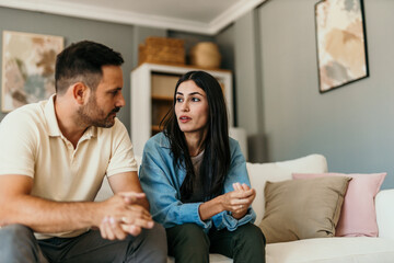 fight, divorce and depression with couple on sofa for conflict, therapy and mental health or marriag
