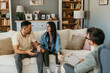 © La Famiglia - Shot of an upset young couple sitting together during a consultation with a psychologist