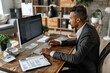 © Сергей Белый - Businessman at Desk Using Computer to Calculate Taxes from High Angle View