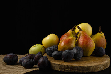 Wall Mural - Fresh fruits on a black background