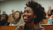 © VK Studio - A student in a lecture hall listens attentively with a broad smile, reflecting a positive and engaged learning experience.