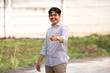 © Izzgallery - Smiling and pointing to front with finger poses. A guy smiling while pointing at the camera.