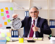 © Elnur - Aged man employee in conflicting priorities concept