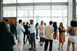 © Jacob Lund - Corporate crowd engaging in teamwork during business event in modern office space