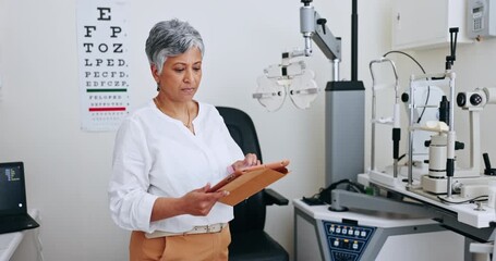 Canvas Print - Mature woman, optometry and tablet for research, consultation and technology for medical service. Mexican person, optometrist and checking results or eye care, internet and healthcare in office