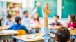 © thanakrit - Student raising hand in classroom.