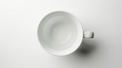 Canvas Print - Empty white coffee mug on a blank background, waiting to be filled