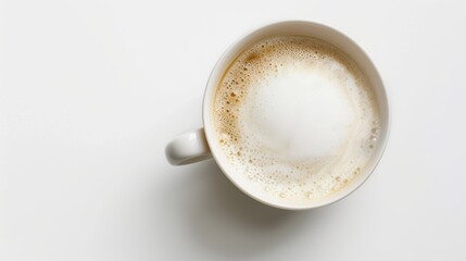 White cup filled with coffee and milk foam on white background