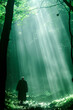 © The Blue Wave - A person stands in a forest under beams of light streaming through the trees evoking a sense of divinity and hope.