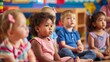 © keiron - Preschool children learning in classroom, diverse kindergarten kids listening to teacher, education concept