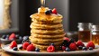 © Subhan - a tall stack of pancakes with a drizzle of syrup