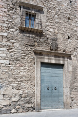 stone portal of medieval house at historical hilltop little town, Narni, Italy